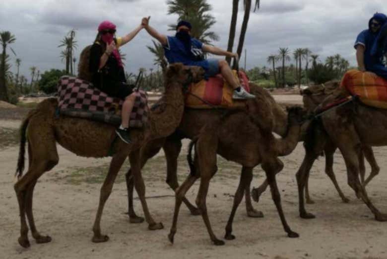 People enjoying the tour on camelback